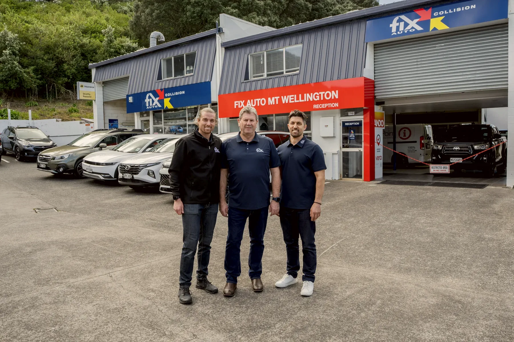 The owners of Fix Auto Mt Wellington outside the workshop on Portage Road