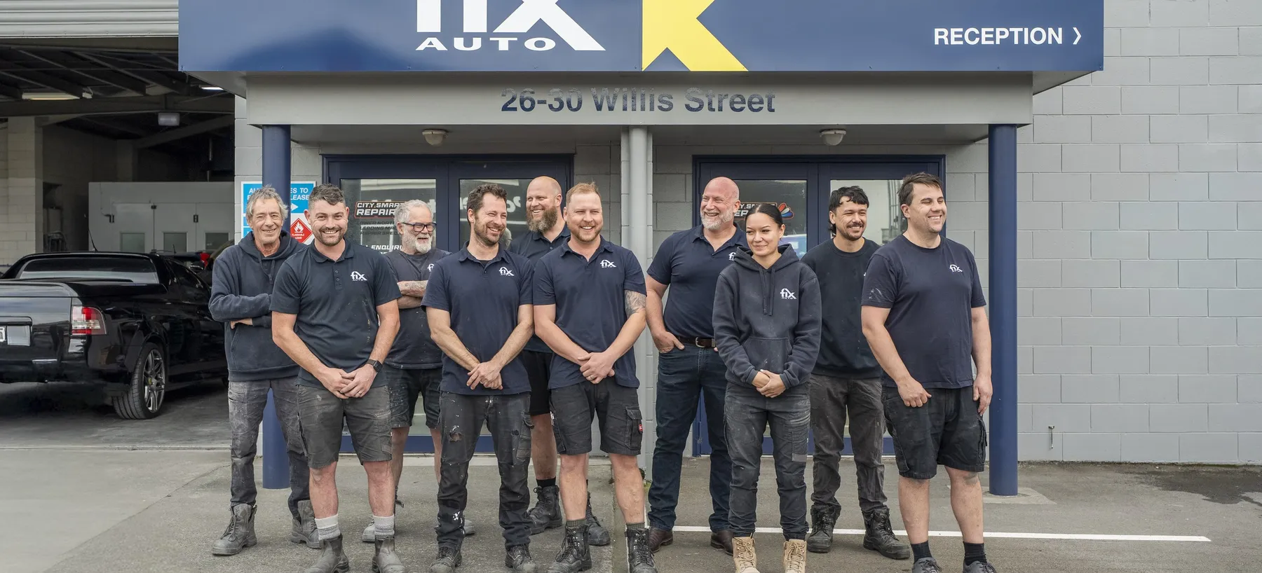 The Fix Auto Palmerston North CBD team outside the workshop on Willis Street