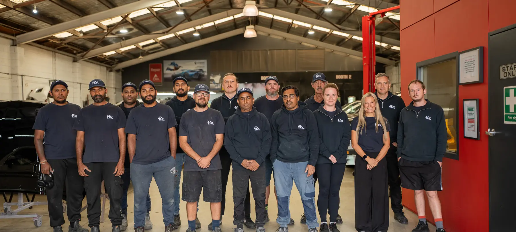 The Fix Auto Penrose team inside the workshop