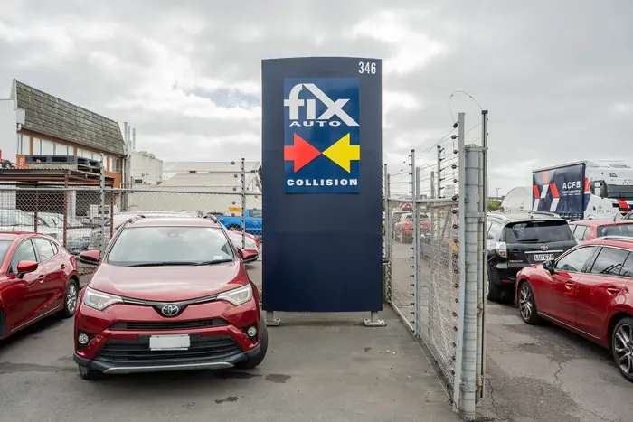 Fix Auto Collision sign at the 346 Neilson Street entrance